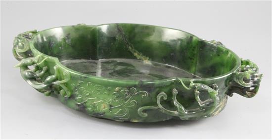 A large Chinese spinach green jade quatre-lobed bowl, Qianlong mark, width 37cm
